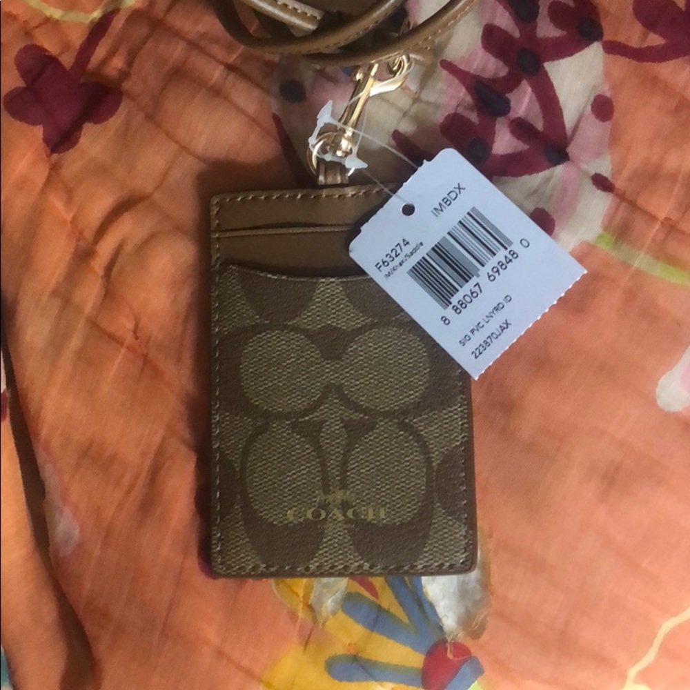 Tan leather Coach lanyard 🐎